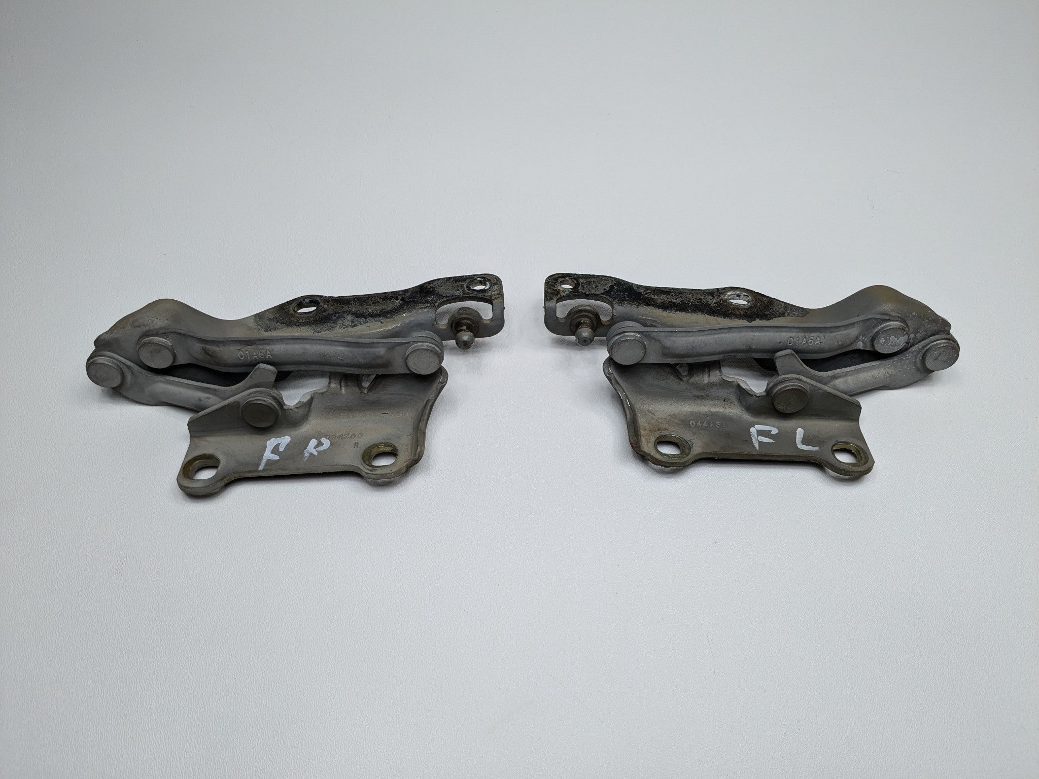 2005 - 2007 OEM NISSAN ARMADA FRONT LEFT AND RIGHT SIDE HOOD HINGE BRACKET SET
