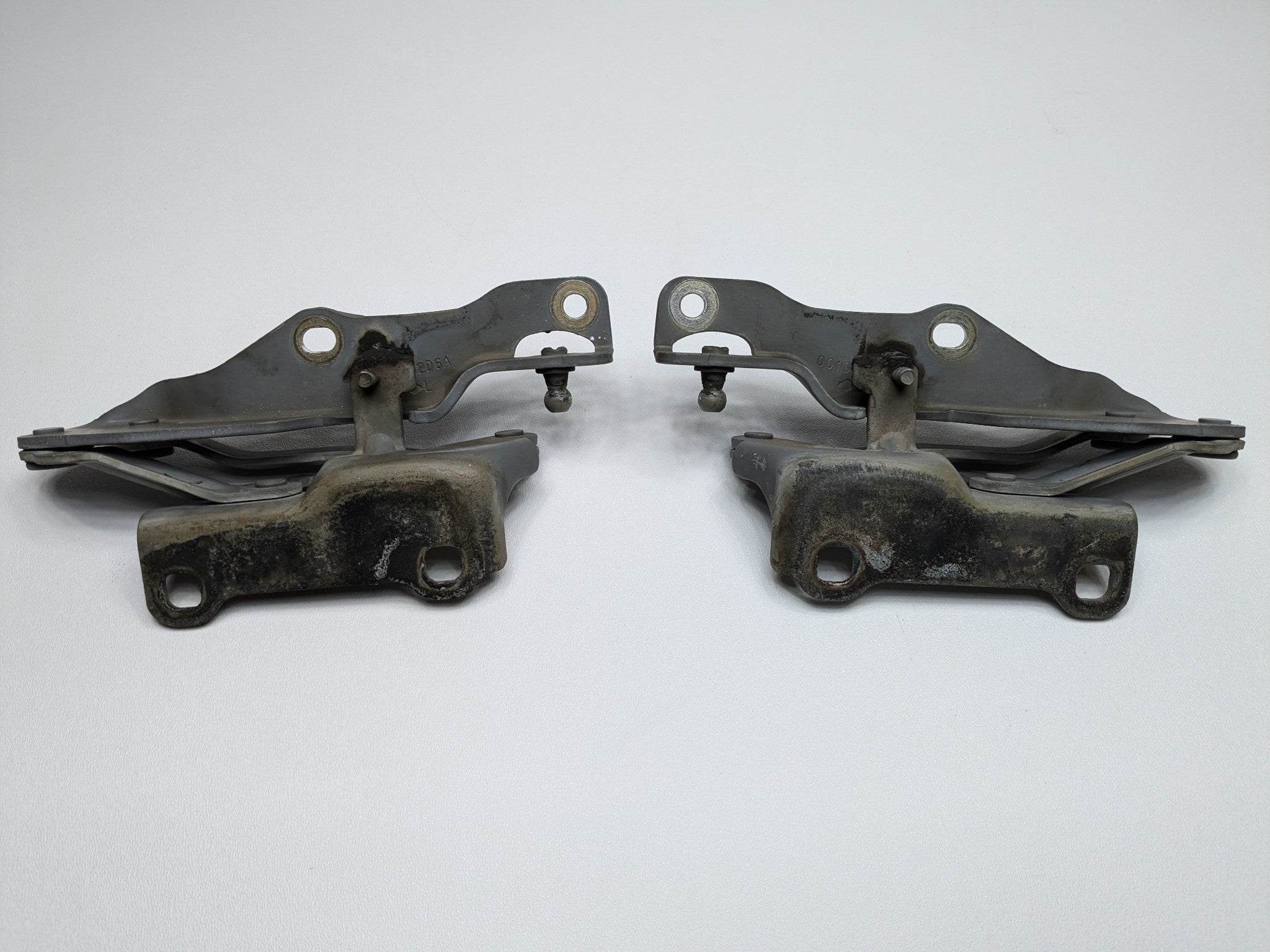 2005 - 2007 OEM NISSAN ARMADA FRONT LEFT AND RIGHT SIDE HOOD HINGE BRACKET SET