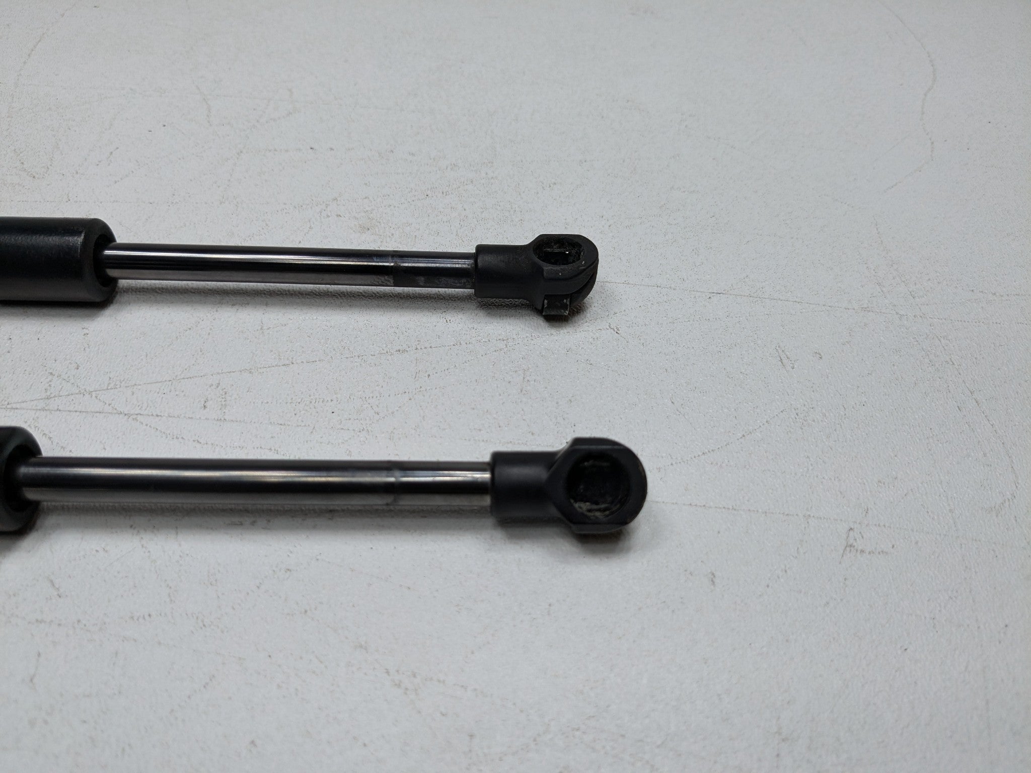 06 - 08 OEM PORSCHE CAYMAN FRONT LEFT AND RIGHT SIDE HOOD SUPPORT SHOCK STRUT