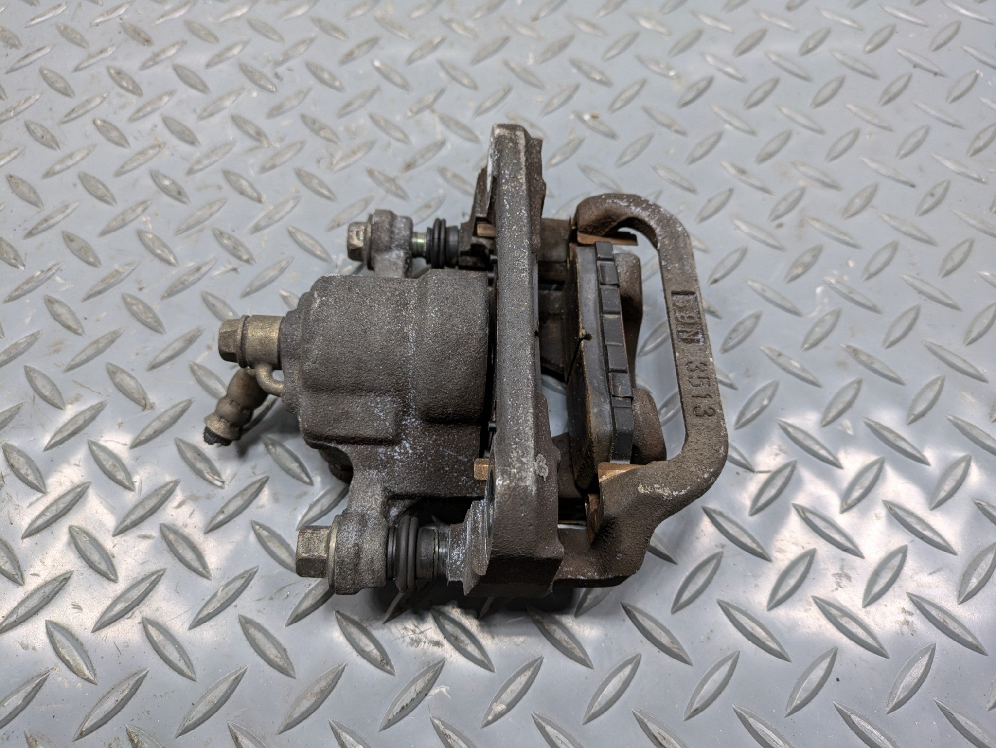 2004 - 2006 OEM NISSAN MAXIMA REAR LEFT DRIVER SIDE BRAKE CALIPER ASSEMBLY