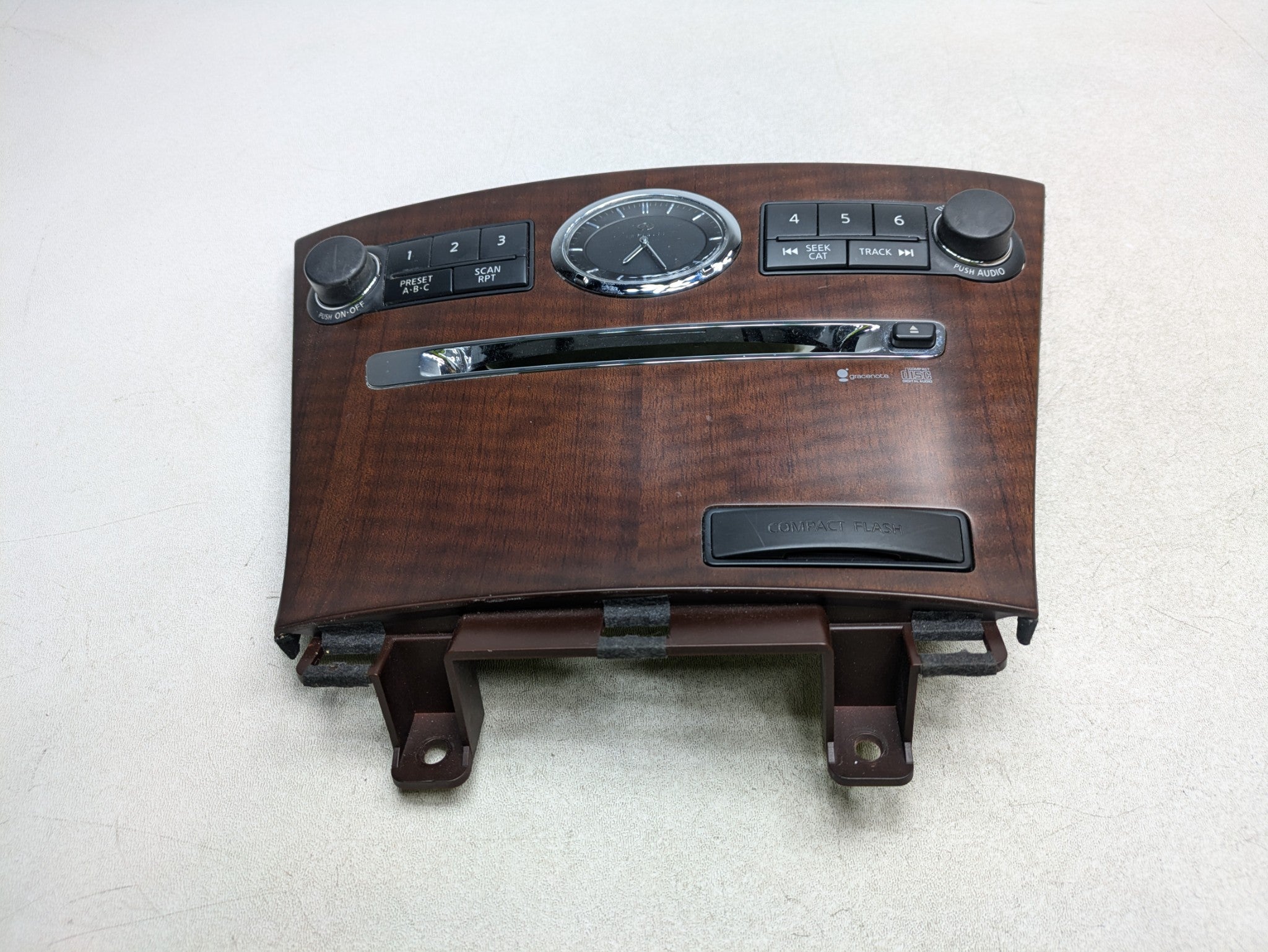 2006 - 2010 INFINITI M35 OEM AUDIO EQUIPMENT RADIO CONTROL ANALOG CLOCK PANEL