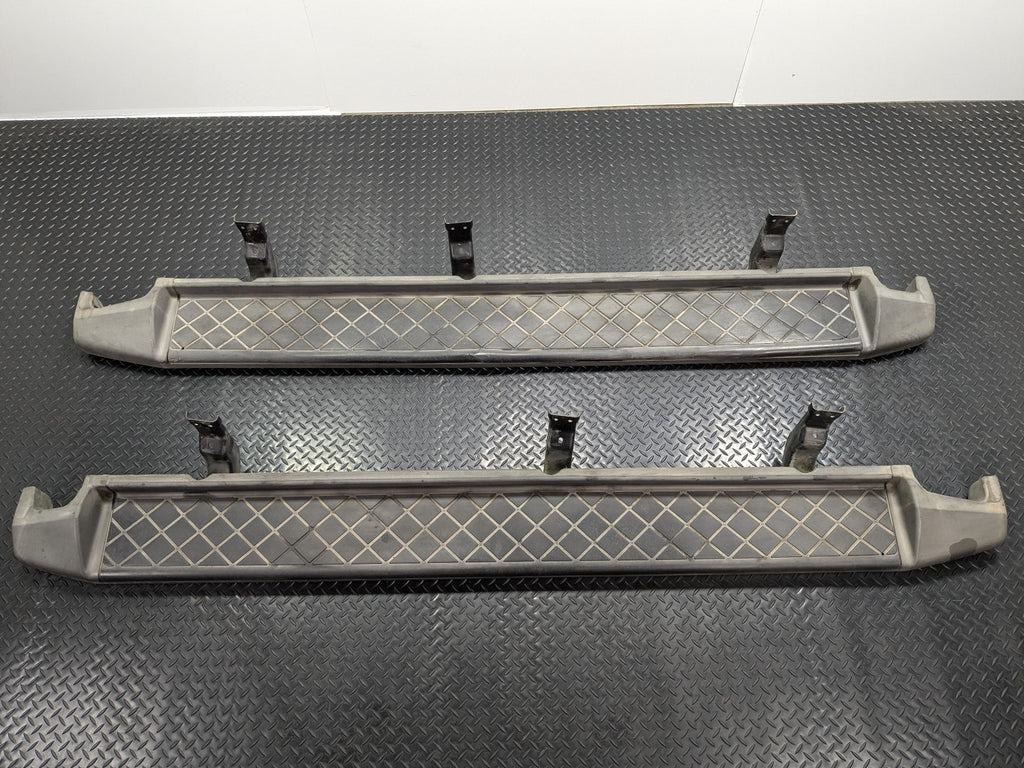 05 - 07 OEM NISSAN ARMADA LEFT AND RIGHT SIDE RUNNING BOARD STEP PAD ASSEMBLY