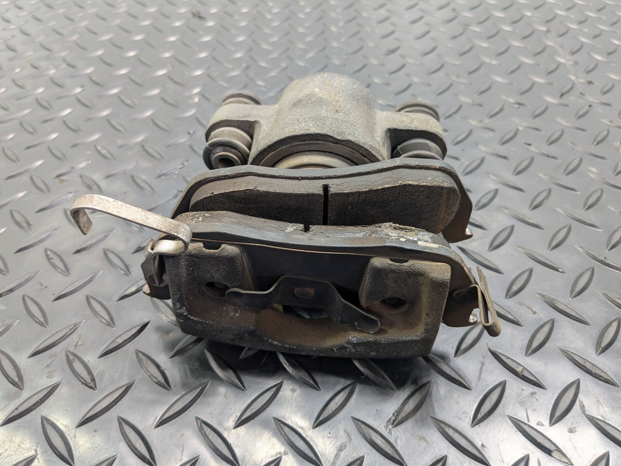 2005 - 2007 OEM NISSAN ARMADA REAR LEFT DRIVER SIDE BRAKE CALIPER