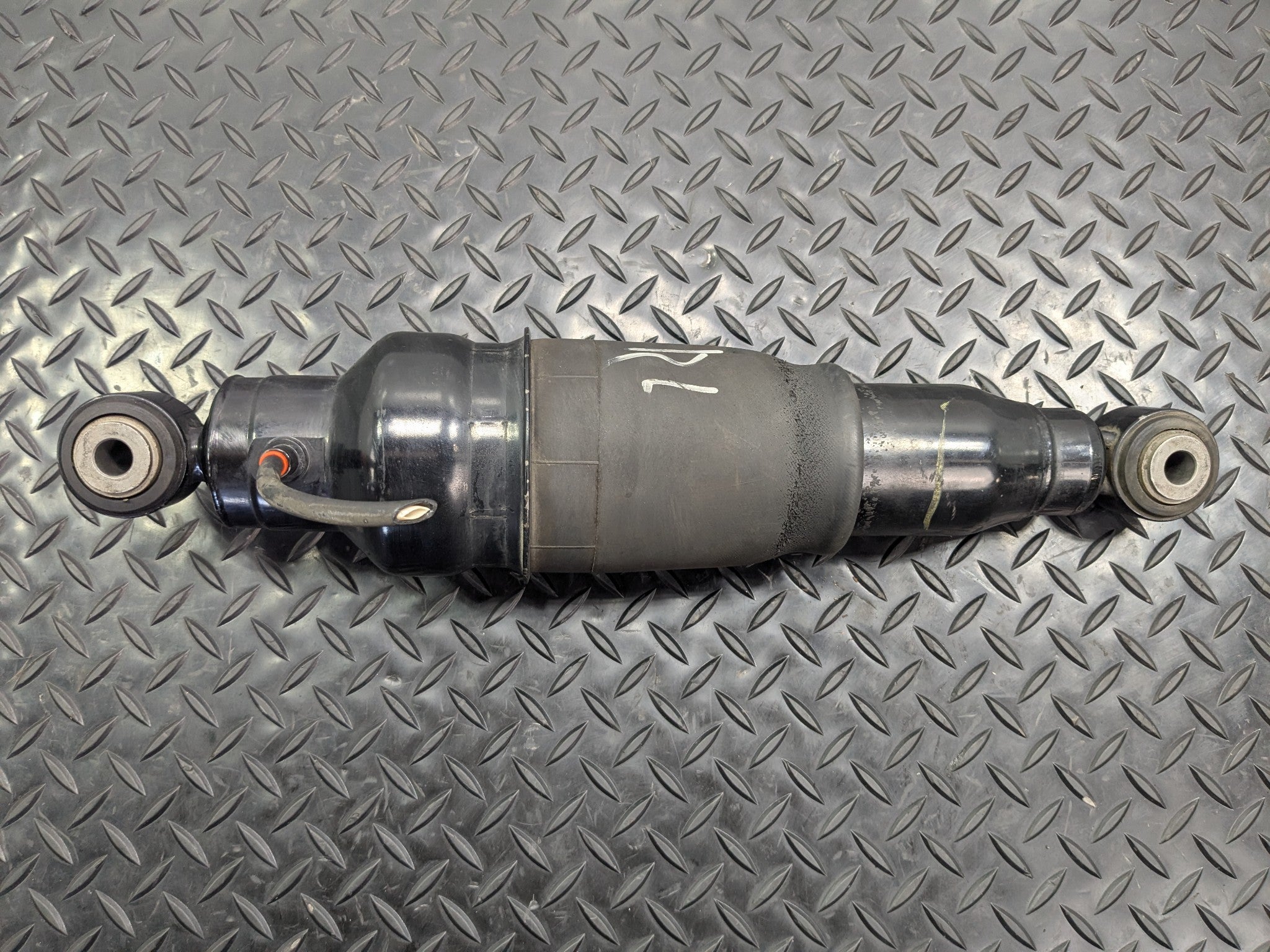 2005 - 2007 OEM NISSAN ARMADA REAR LEFT DRIVER SIDE SHOCK STRUT ASSEEMBLY