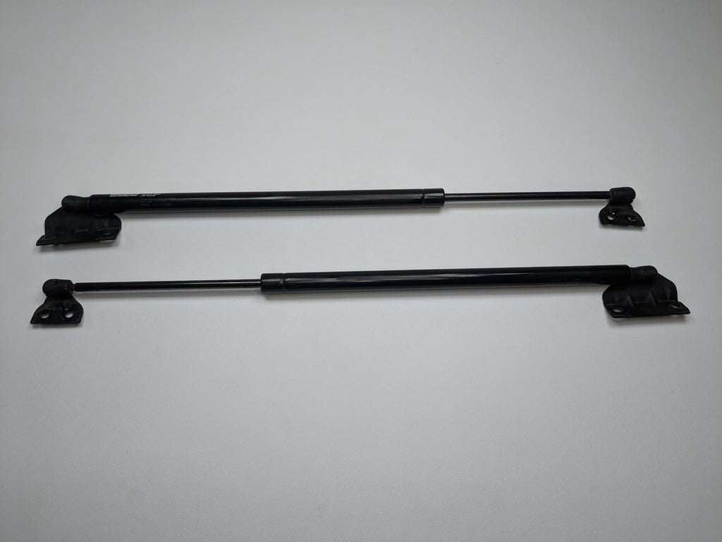 05 - 07 OEM NISSAN ARMADA REAR LEFT AND RIGHT TAILGATE SHOCK STRUT SUPPORT SET