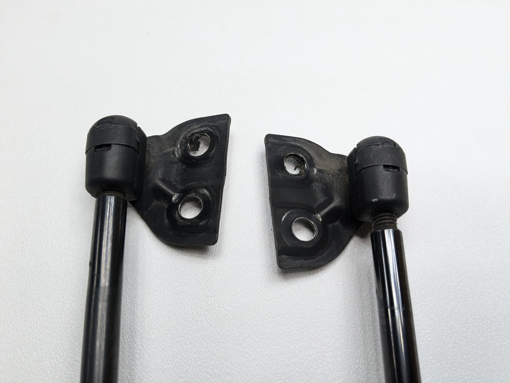 05 - 07 OEM NISSAN ARMADA REAR LEFT AND RIGHT TAILGATE SHOCK STRUT SUPPORT SET