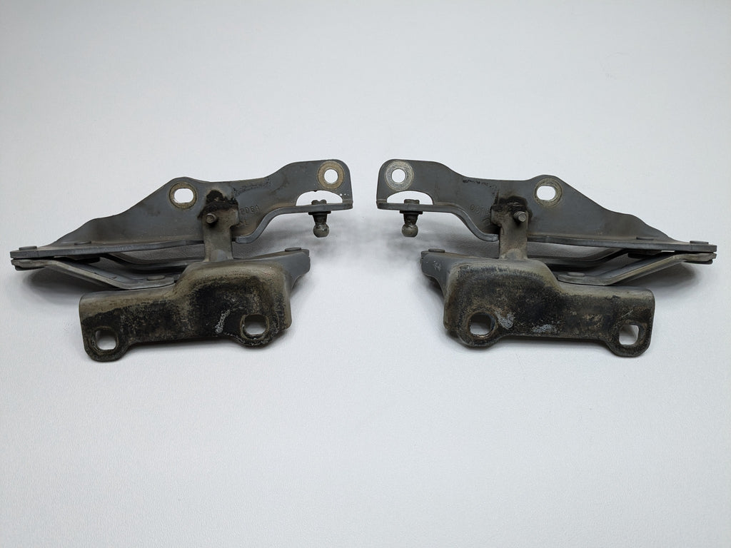 2005 - 2007 OEM NISSAN ARMADA FRONT LEFT AND RIGHT SIDE HOOD HINGE BRACKET SET