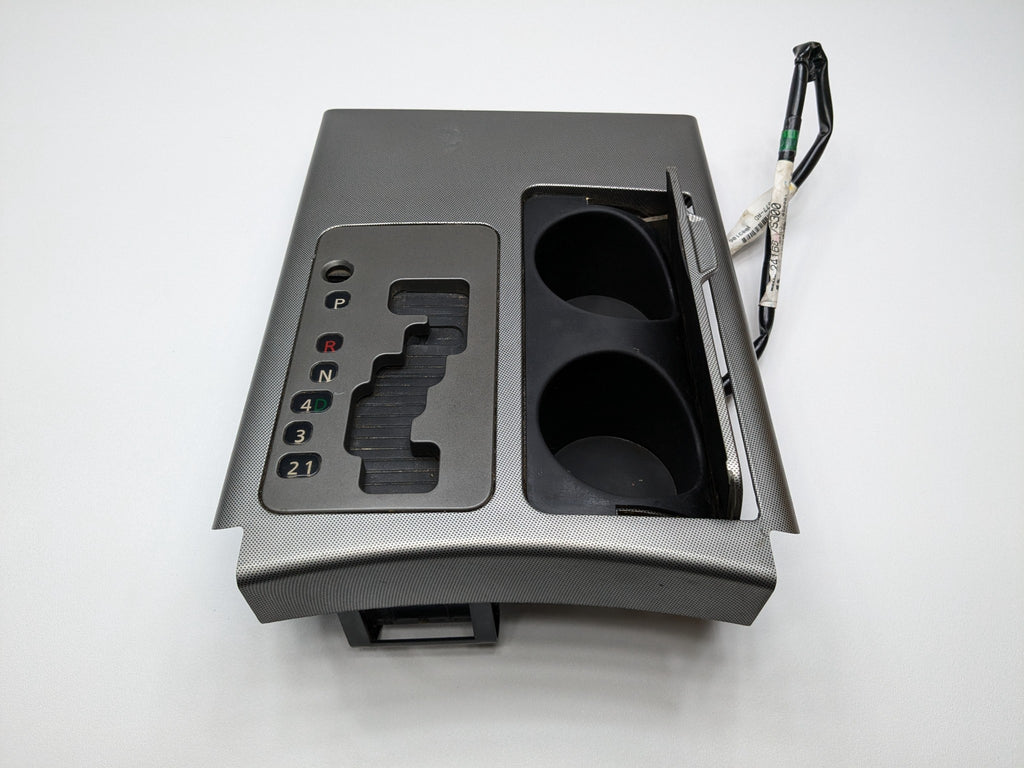 2005 - 2007 OEM NISSAN ARMADA CENTER CONSOLE GEAR SHIFTER TRIM BEZEL CUP HOLDER