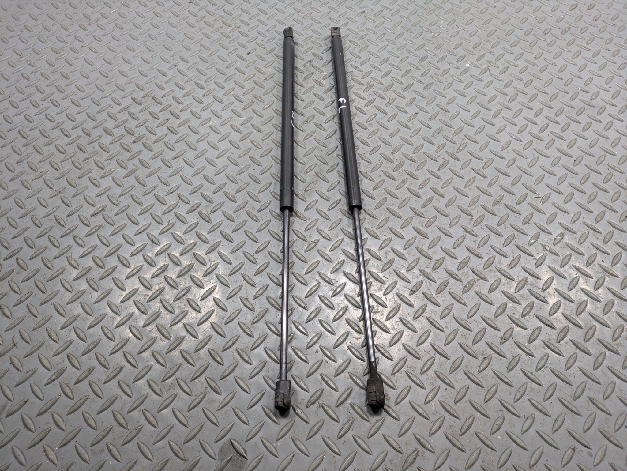 2009 - 2012 OEM FORD FLEX FRONT LEFT AND RIGHT HOOD SUPPORT STRUT SHOCK SET