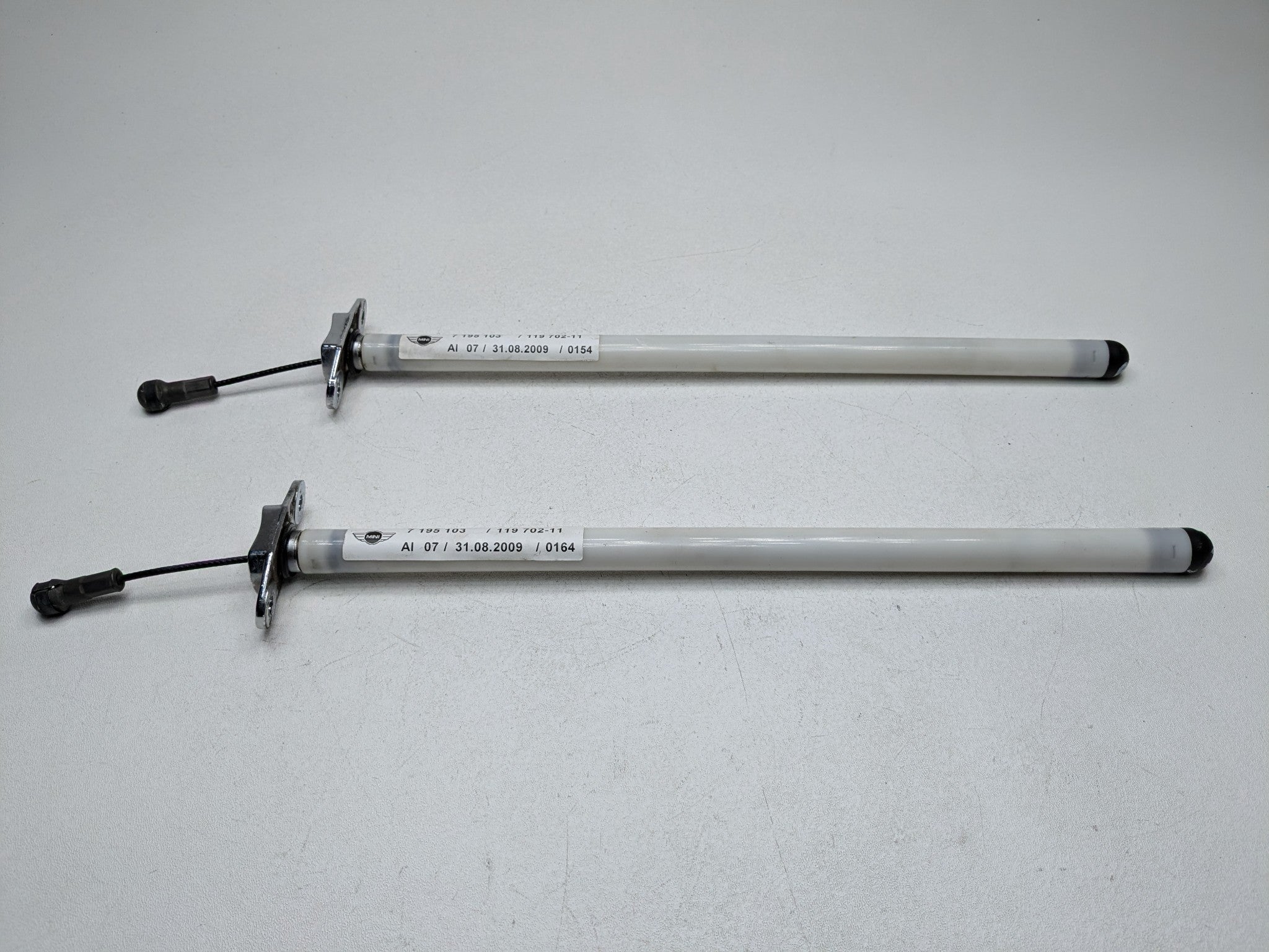 2009 - 2010 OEM MINI COOPER CONVERTIBLE REAR TRUNK LID SUPPORT RETRACTOR SET