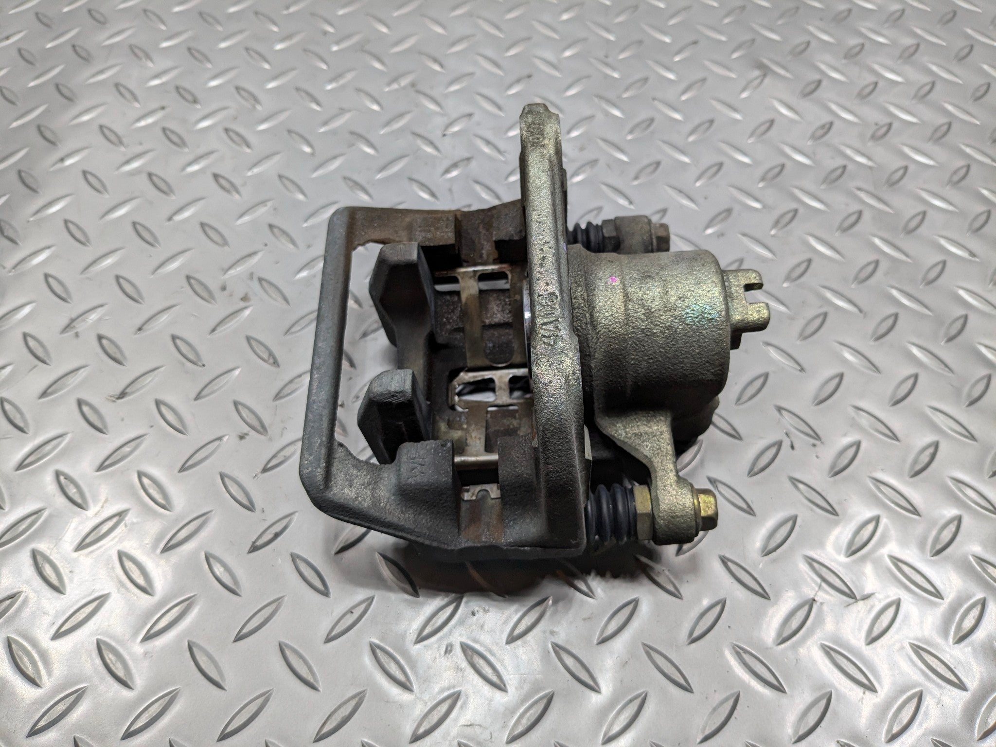 2004 - 2006 OEM ACURA TL REAR LEFT DRIVER SIDE BRAKE CALIPER ASSEMBLY