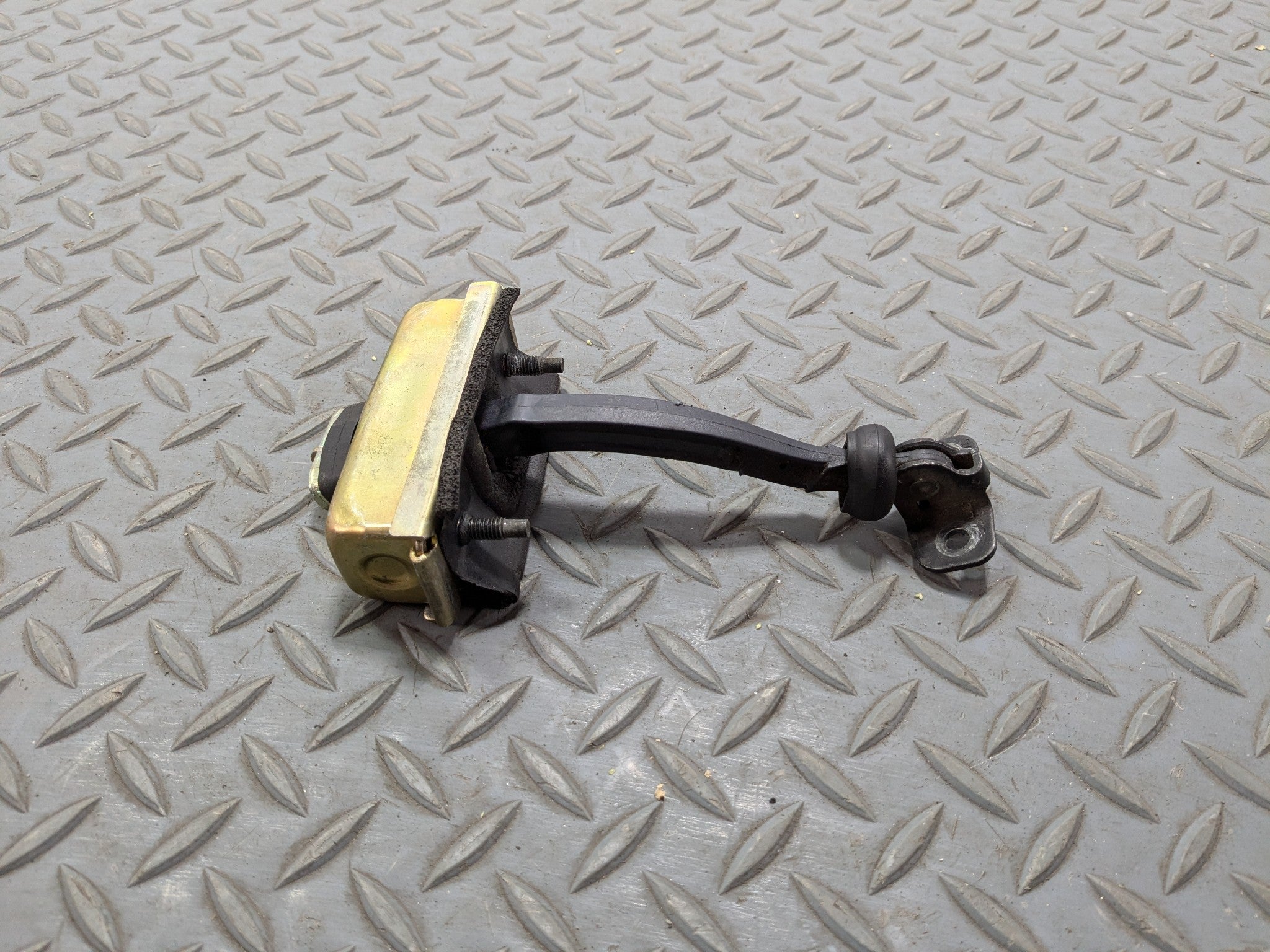 03 - 06 OEM LINCOLN NAVIGATOR FRONT LEFT DRIVER SIDE DOOR CHECK STRAP STOPPER