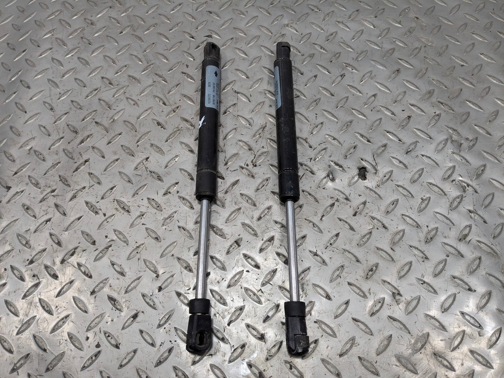 2005 - 2007 OEM CADILLAC CTS FRONT LEFT AND RIGHT SIDE HOOD SUPPORT SHOCK STRUT