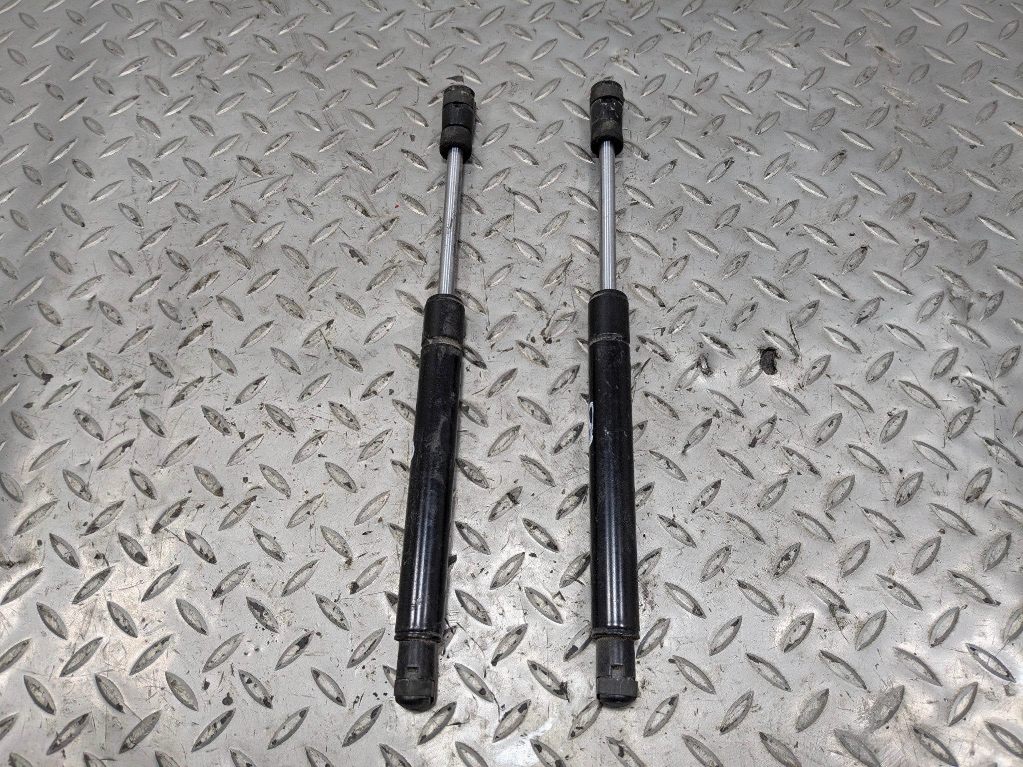 2005 - 2007 OEM CADILLAC CTS FRONT LEFT AND RIGHT SIDE HOOD SUPPORT SHOCK STRUT