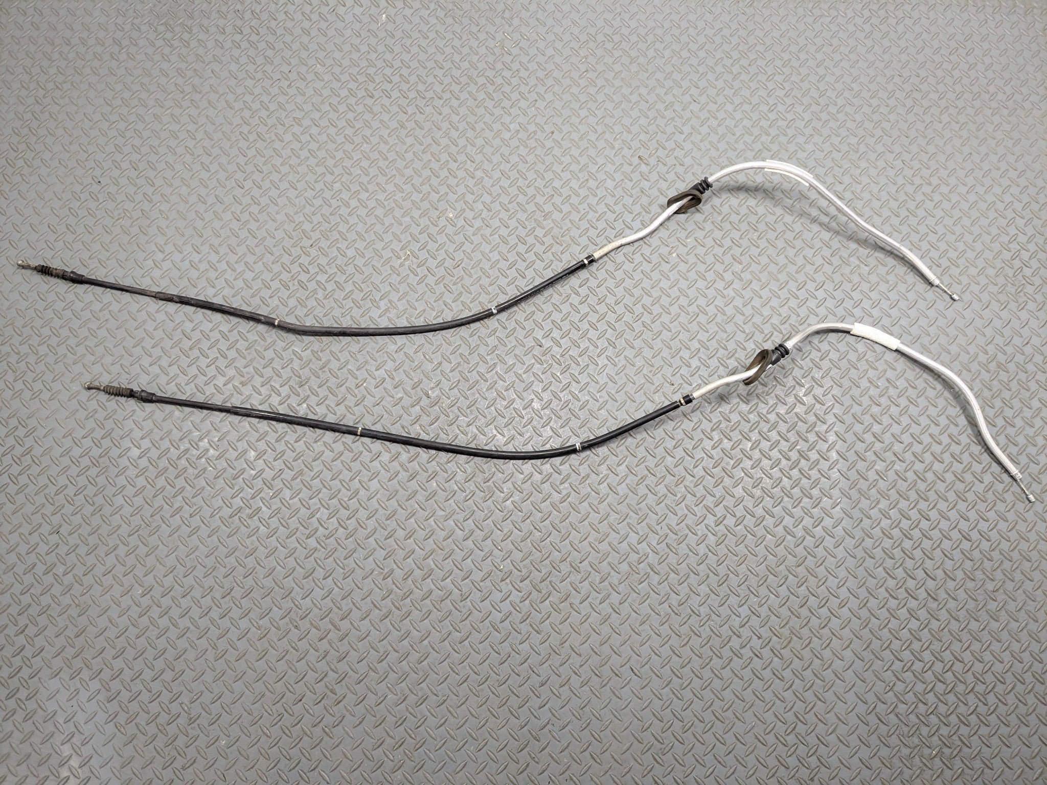 10 - 15 VOLKSWAGEN PASSAT OEM EMERGENCY PARKING BRAKE CABLES REAR LEFT AND RIGHT