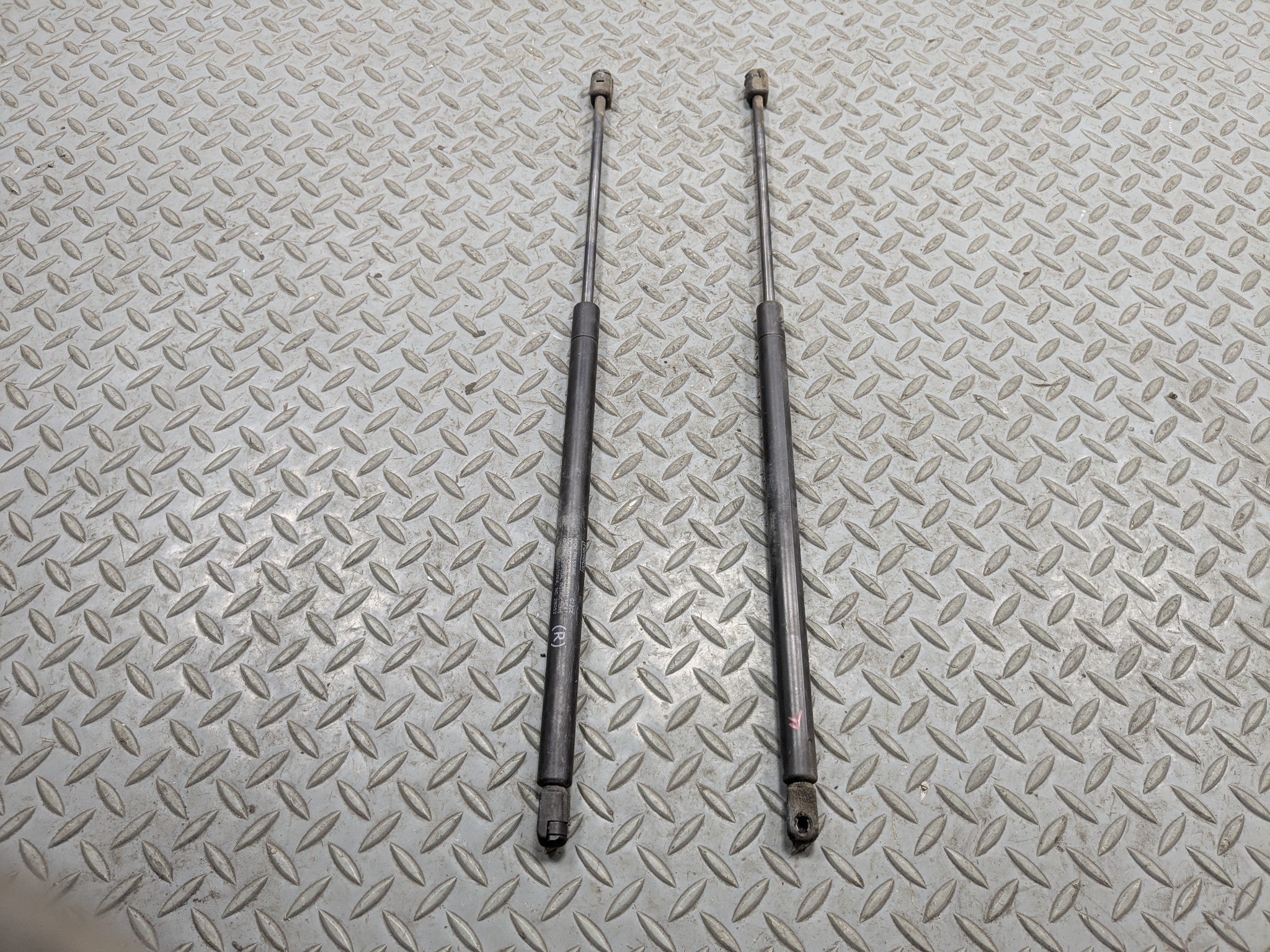 10 - 15 LINCOLN MKT OEM HOOD SHOCK STRUT SET OF TWO FRONT LEFT AND RIGHT SIDE