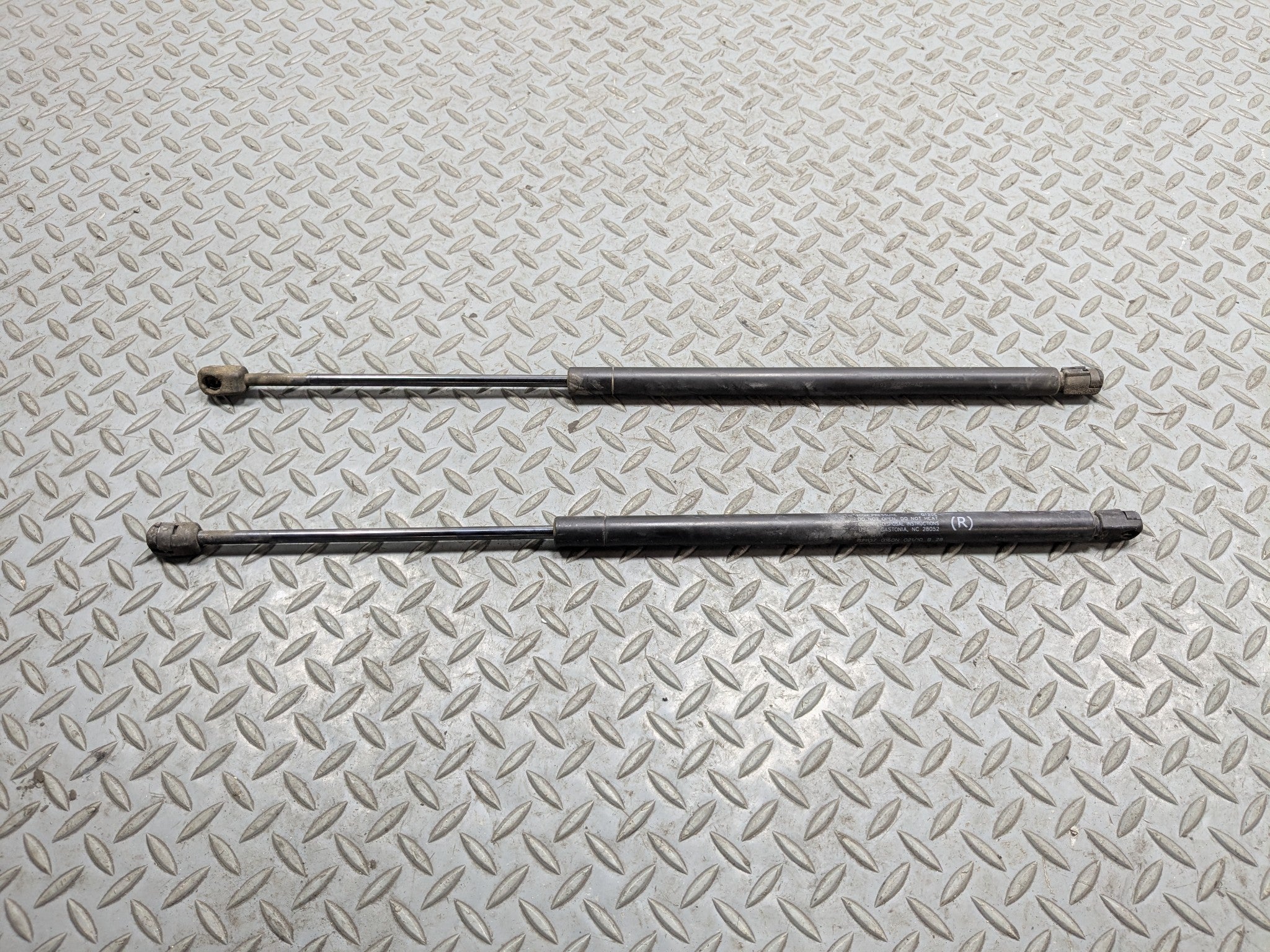 10 - 15 LINCOLN MKT OEM HOOD SHOCK STRUT SET OF TWO FRONT LEFT AND RIGHT SIDE