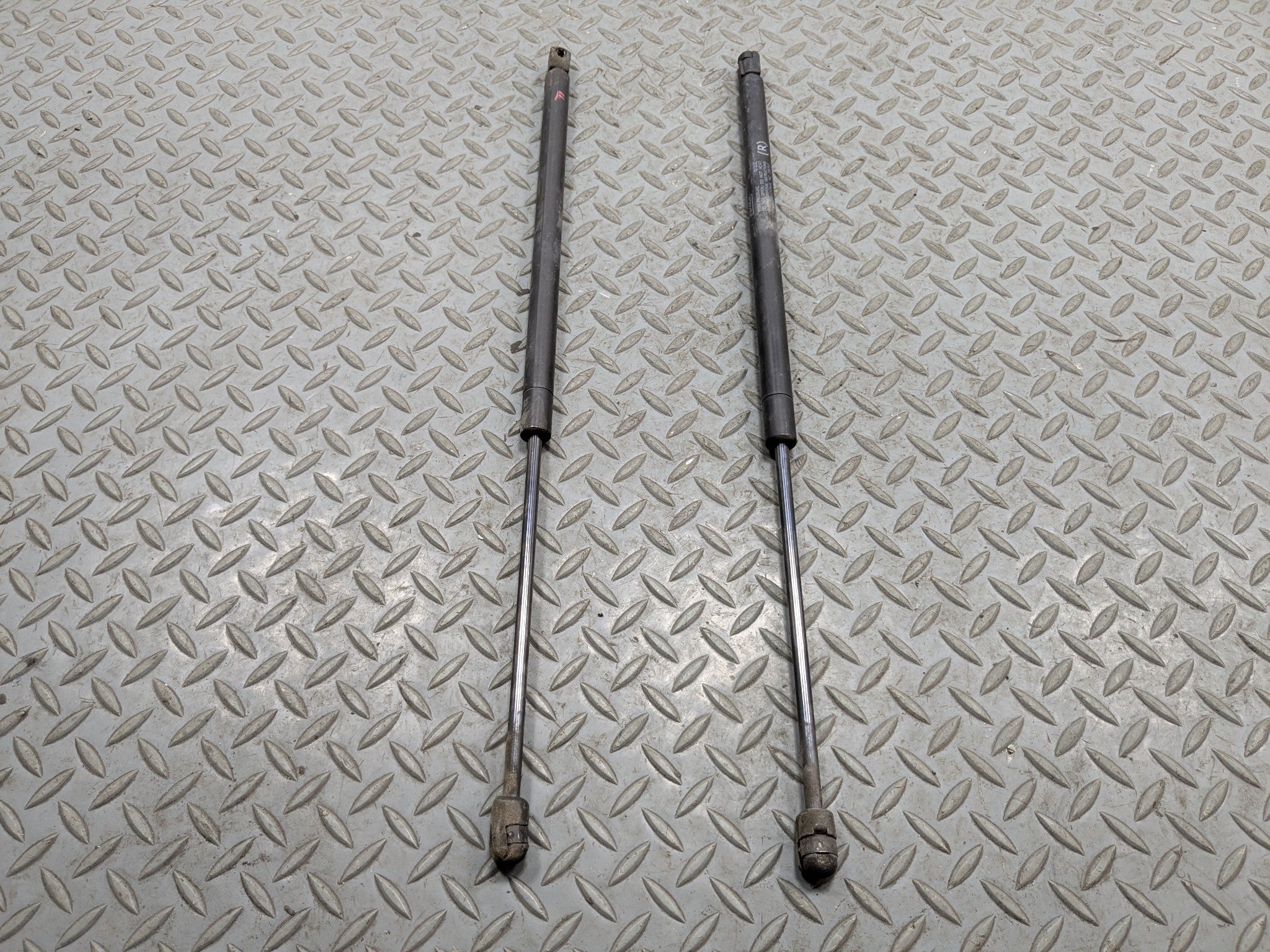 10 - 15 LINCOLN MKT OEM HOOD SHOCK STRUT SET OF TWO FRONT LEFT AND RIGHT SIDE