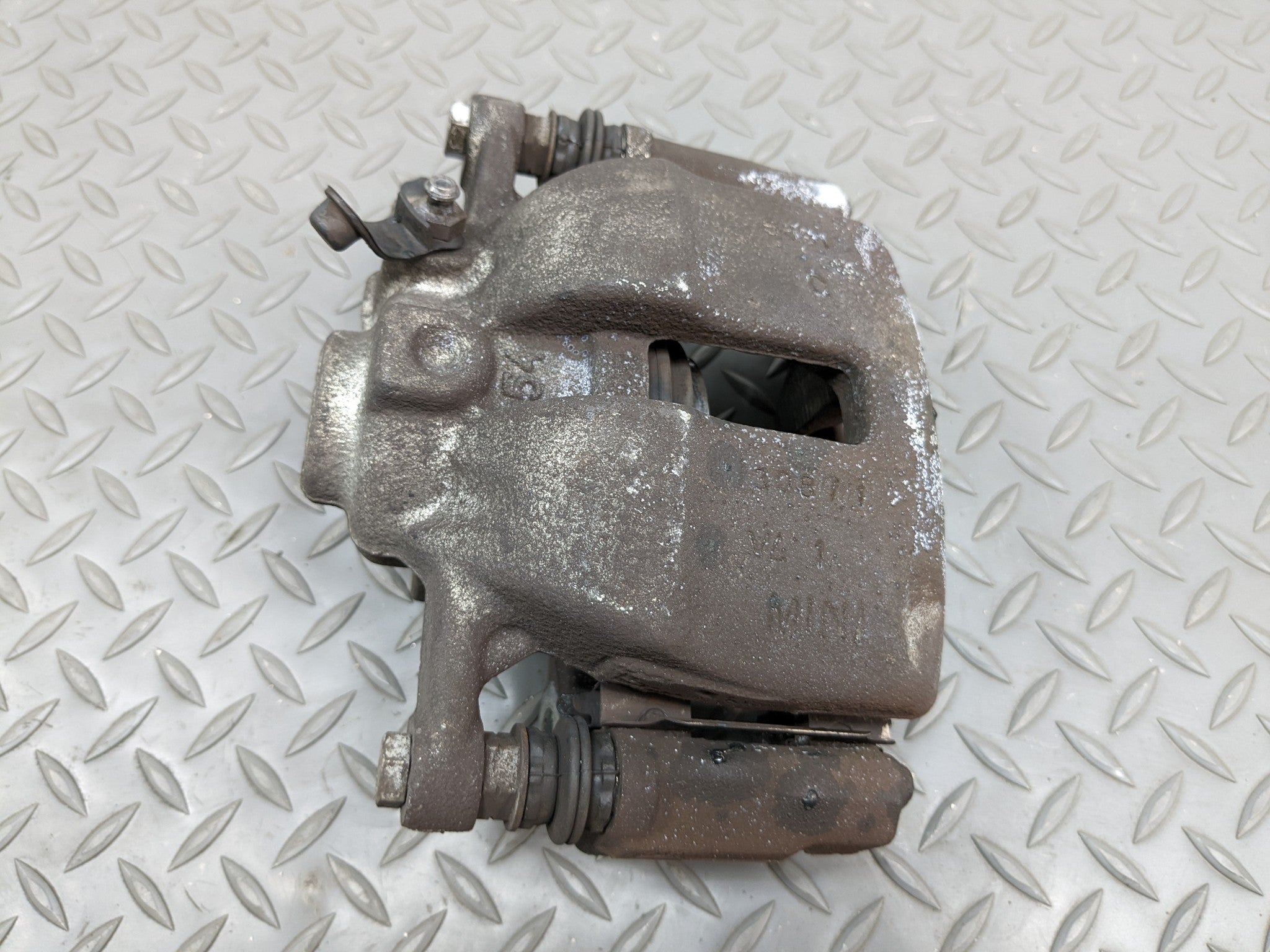 2011 - 2014 MINI COOPER CLUBMAN OEM BRAKE CALIPER BASE FRONT LEFT DRIVER SIDE
