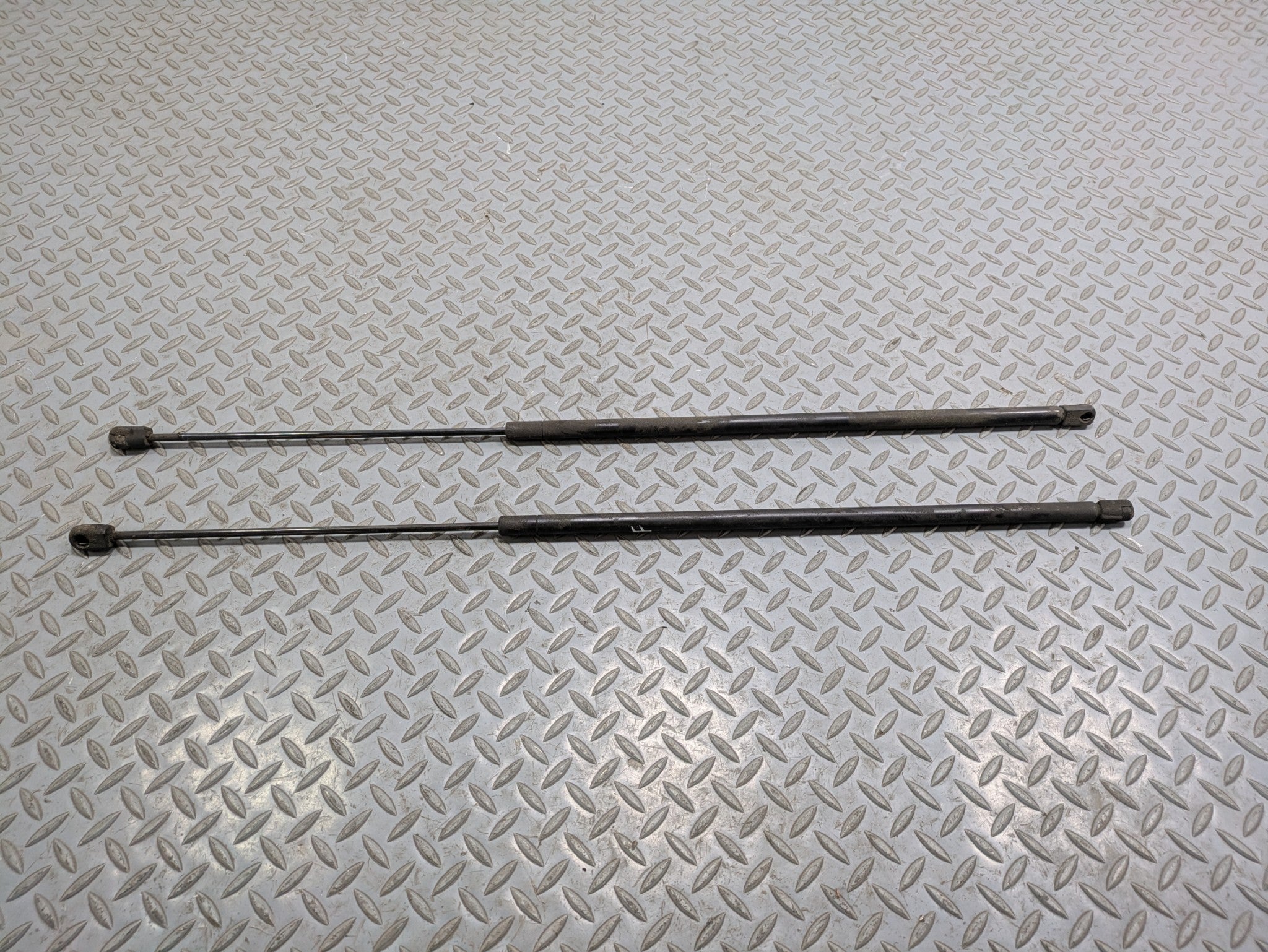 2000 - 2005 CADILLAC DEVILLE OEM HOOD BONNET SHOCK STRUT SUPPORT LEFT AND RIGHT