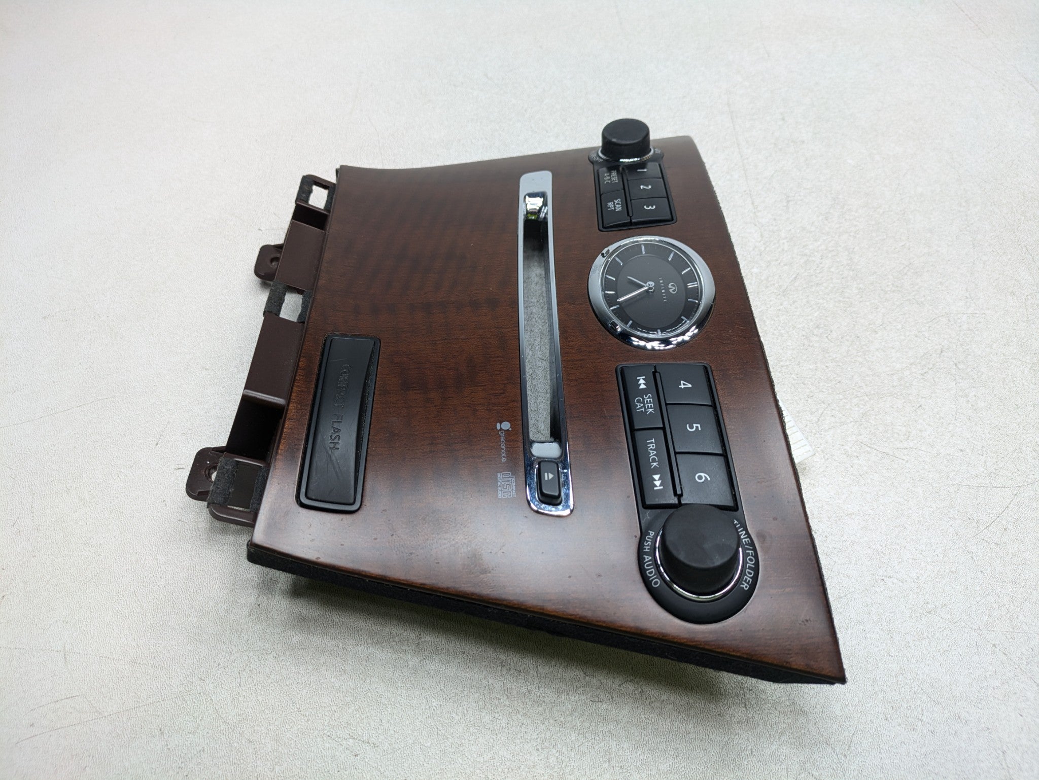 2006 - 2010 INFINITI M35 OEM AUDIO EQUIPMENT RADIO CONTROL ANALOG CLOCK PANEL