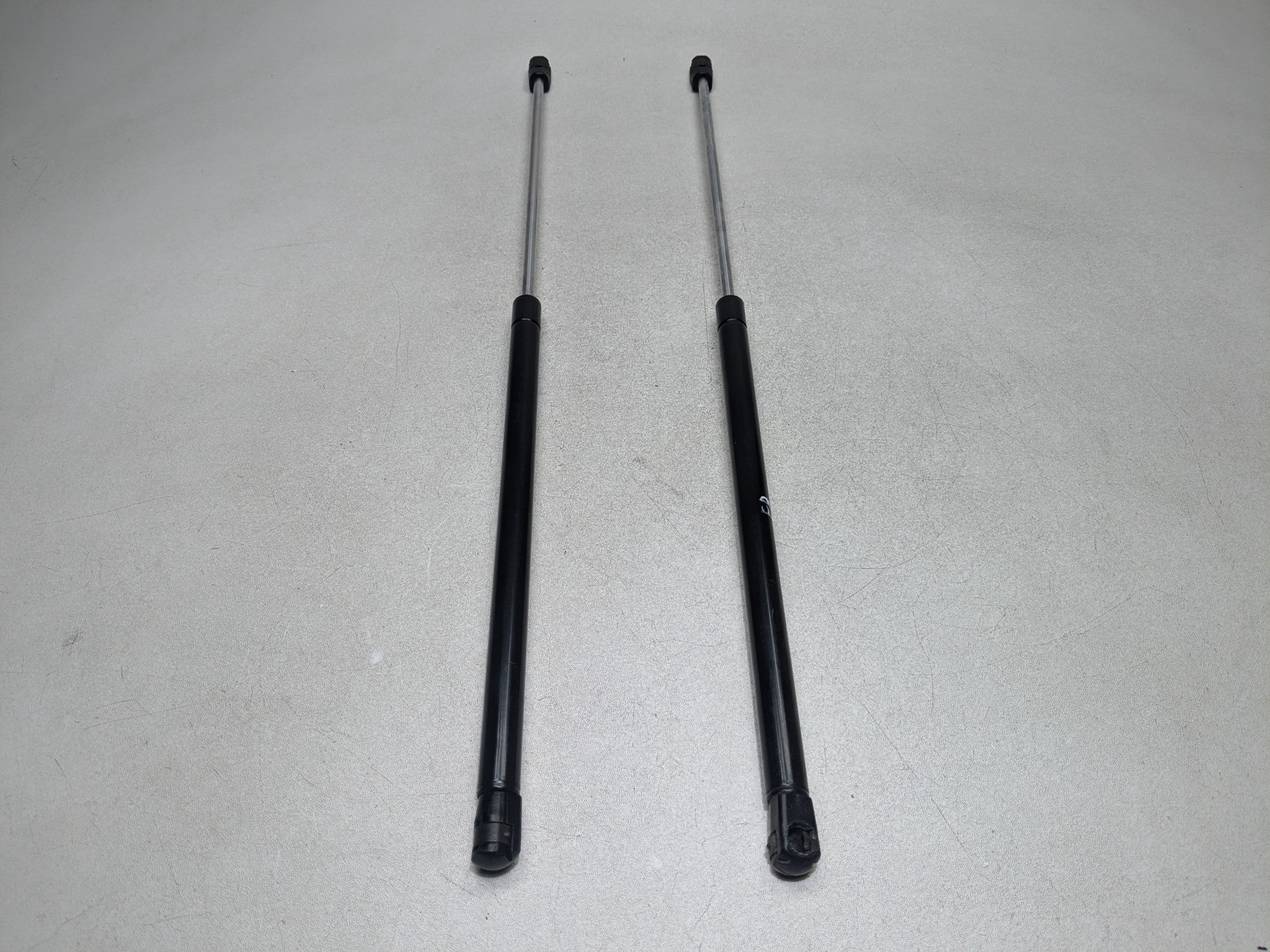2004 - 2009 CADILLAC SRX OEM HOOD SHOCK STRUT SET OF TWO FRONT LEFT AND RIGHT