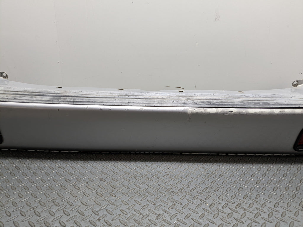 00 – 04 MITSUBISHI MONTERO SPORT OEM REAR BUMPER LOWER COVER PANEL SILVER GRAY
