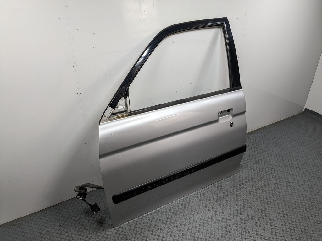 00 – 04 MITSUBISHI MONTERO SPORT OEM DOOR SHELL PANEL SILVER GRAY FRONT LEFT