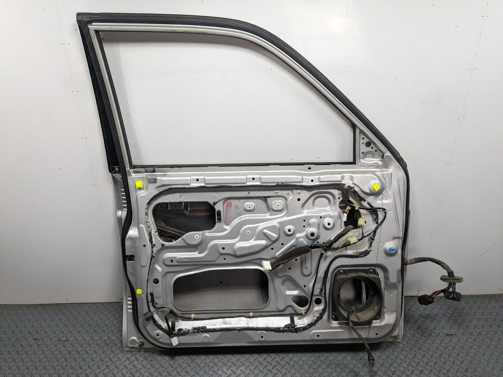 00 – 04 MITSUBISHI MONTERO SPORT OEM DOOR SHELL PANEL SILVER GRAY FRONT LEFT
