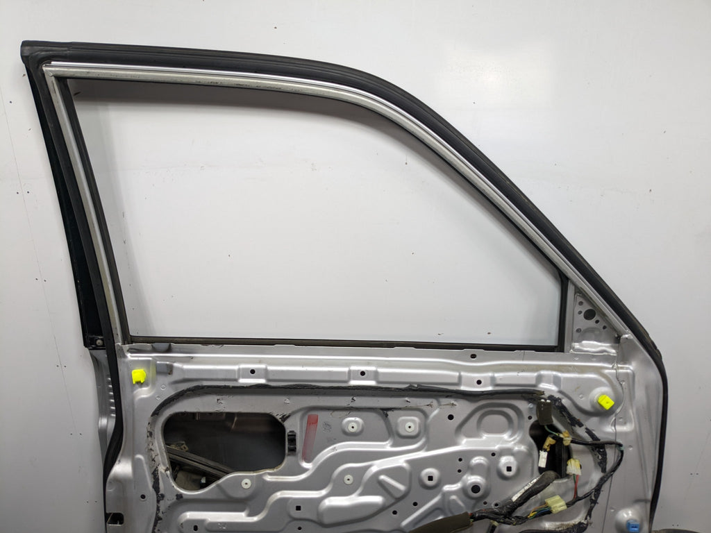 00 – 04 MITSUBISHI MONTERO SPORT OEM DOOR SHELL PANEL SILVER GRAY FRONT LEFT