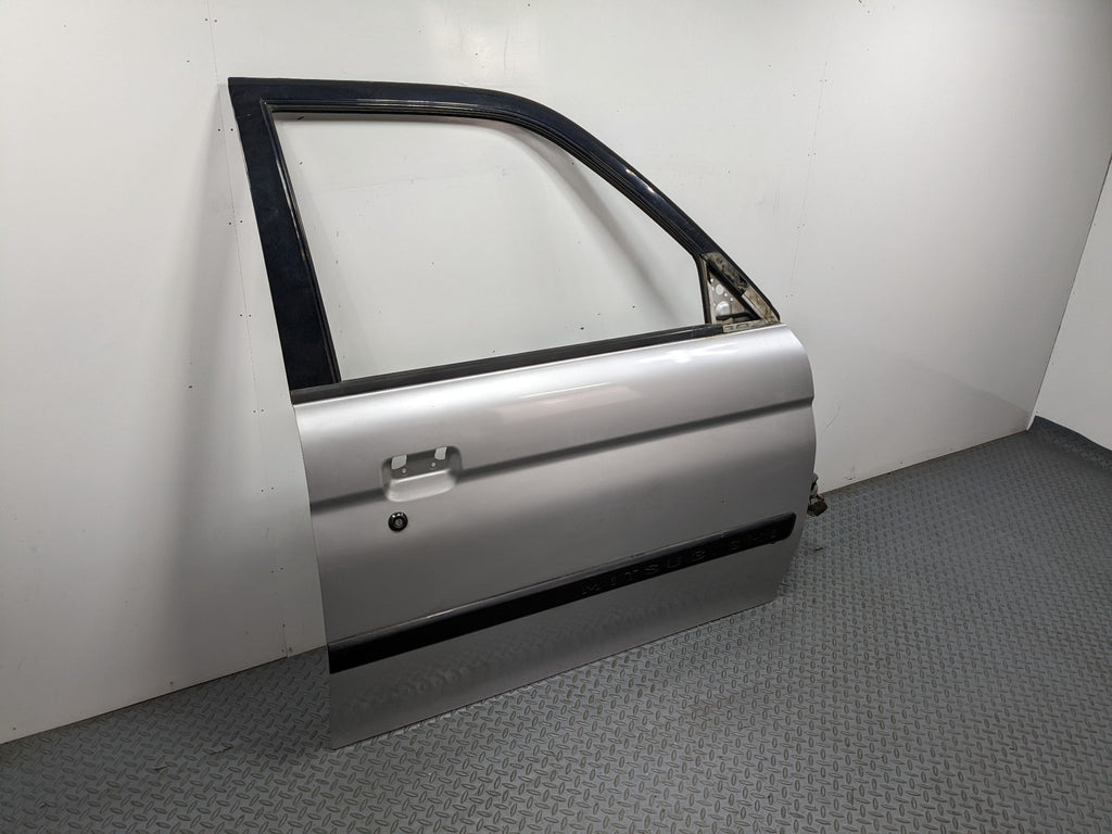 00 – 04 MITSUBISHI MONTERO SPORT OEM DOOR SHELL PANEL SILVER GRAY FRONT RIGHT