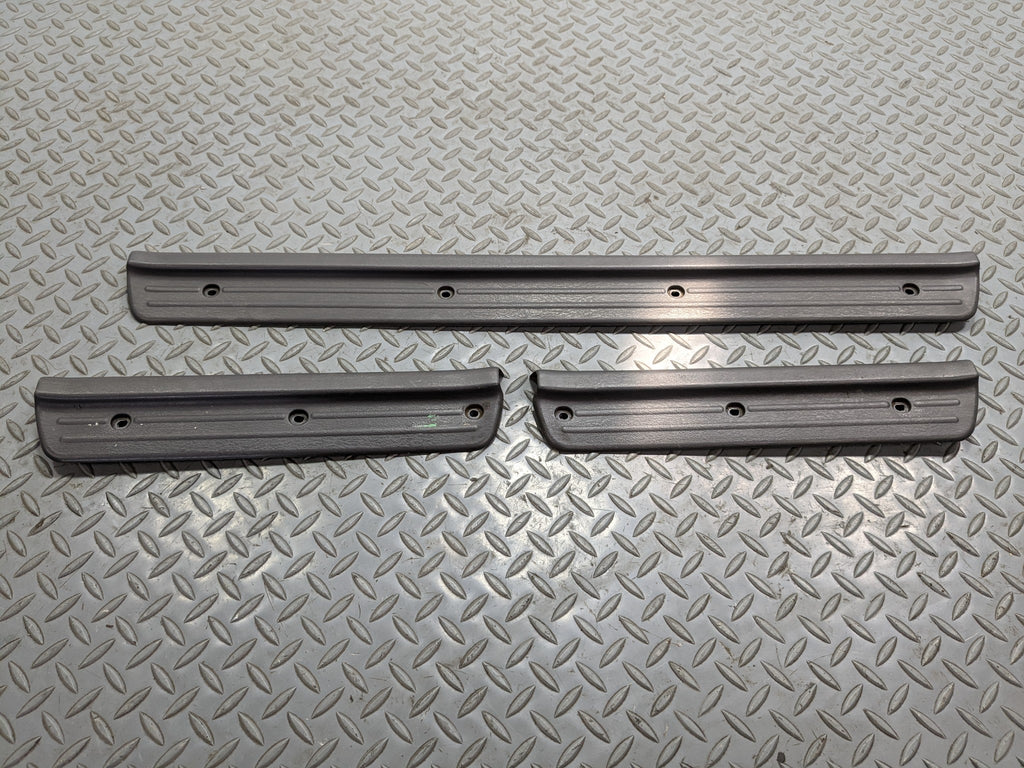 00 - 04 MITSUBISHI MONTERO SPORT OEM SILL SCUFF PLATE FRONT AND REAR LEFT RIGHT